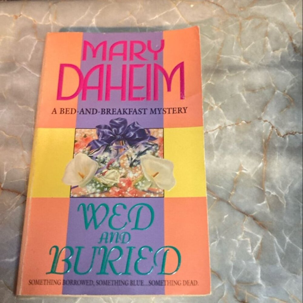 Wed and Buried: A Bed-And-Breakfast Mystery by Mary Daheim